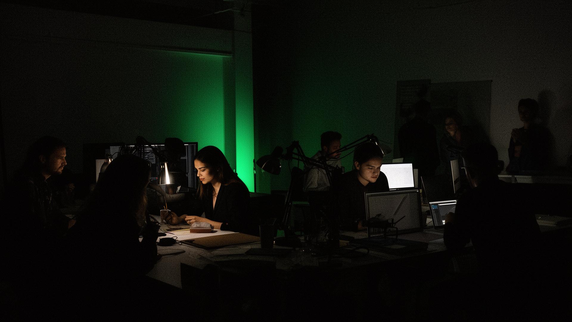 Creative team in dark studio